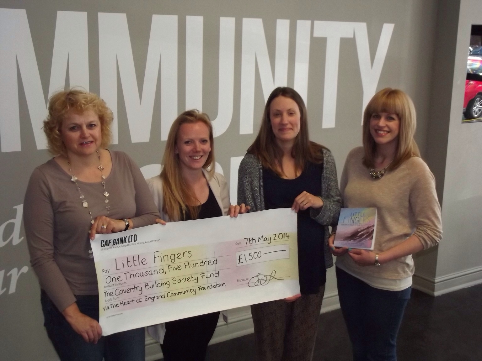 Grant Award being received by Charlotte